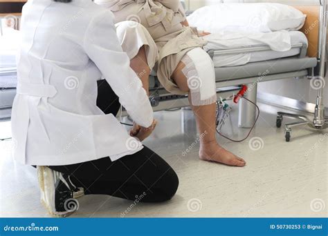 Doctor Doing Physical Therapy for Patient with a Knee Injury Stock Image - Image of indoors ...