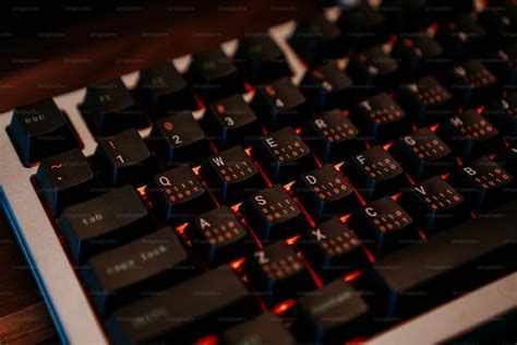 A close up of a black and red keyboard photo – Gaming keyboard Image on ...