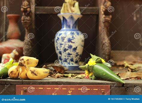 Various Buddhist Food Offerings on a Shelf before and Alter in an Ancient Temple in Northern ...