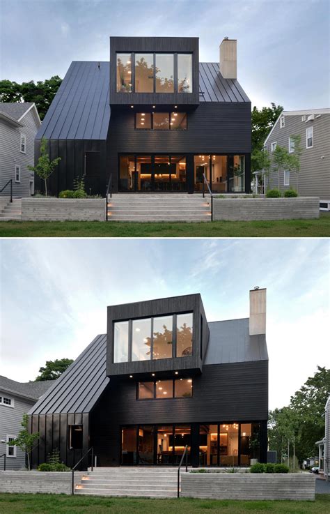 The Black Roof, Siding, And Window Frames On This Home Combine To Make A Cohesive Statement