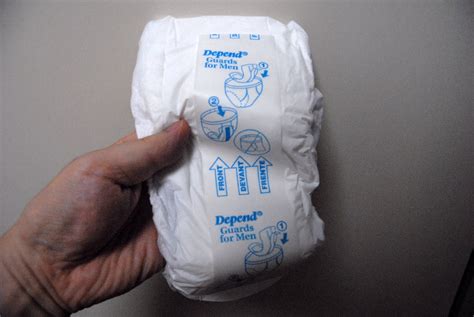 File:Incontinence pad for men without penis holding 2.jpg