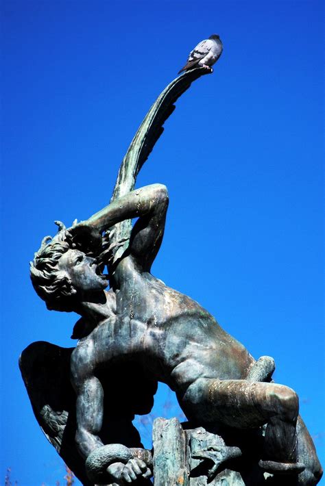 A pigeon bothering Lucifer | The Fallen Angel Statue (Madrid… | Flickr