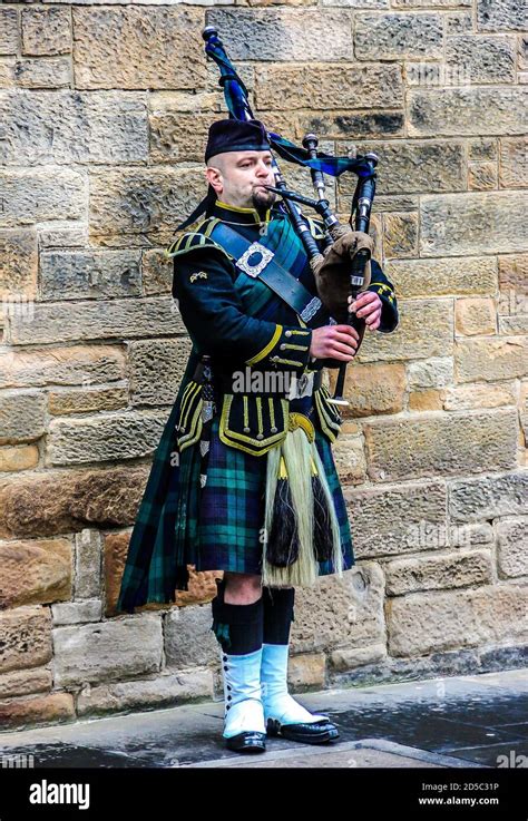 Man playing bagpipe in scottish traditional costume hi-res stock ...