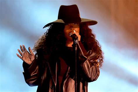 SZA Changes From Leather Trench Coat to Sheer Dress at 2024 Grammys