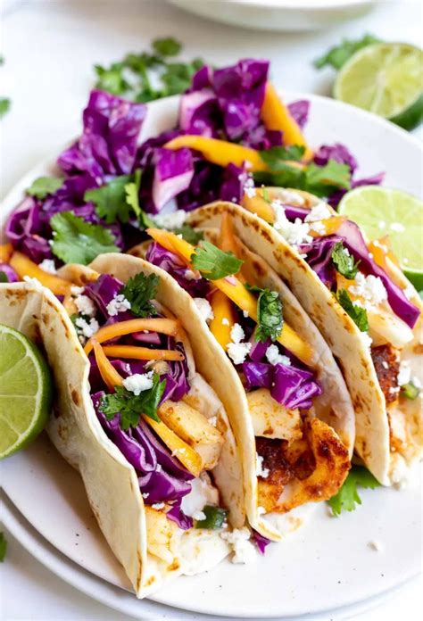 These Easy Baked Fish Tacos with Mango Slaw are a great weeknight dinner idea. Taco Tuesdays ...