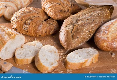 Slices of Wheaten Bread on Wooden Surface Stock Photo - Image of closeup, bread: 160544896