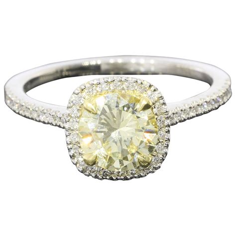 Fancy Light Yellow Canary Diamond gold platinum Halo Ring For Sale at 1stdibs