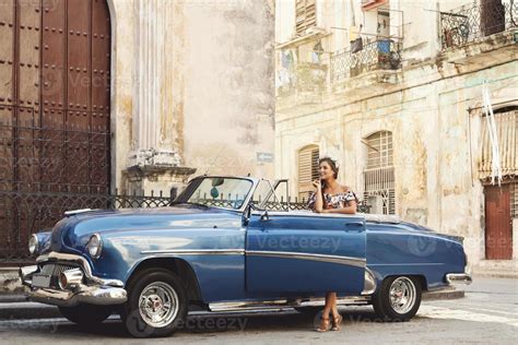 Beautiful woman driving a retro convertible car 16250338 Stock Photo at Vecteezy