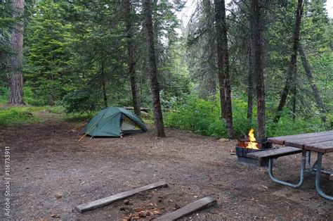 Recreation. A campsite with a tent, a table and an inviting orange ...