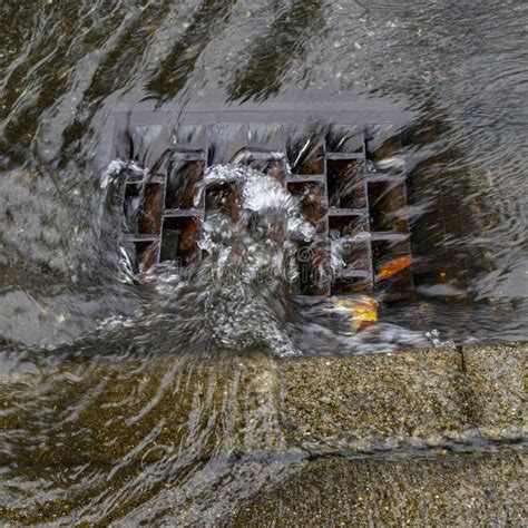 Heavy Rain Caused Flooding in Street, Water Swirling Around Storm Drain ...