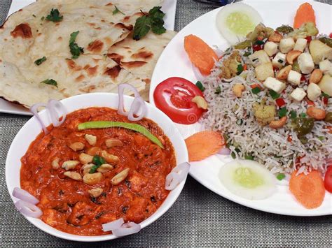 Closeup of Paneer Butter Masala Served with Mixed Fried Rice and Butter ...