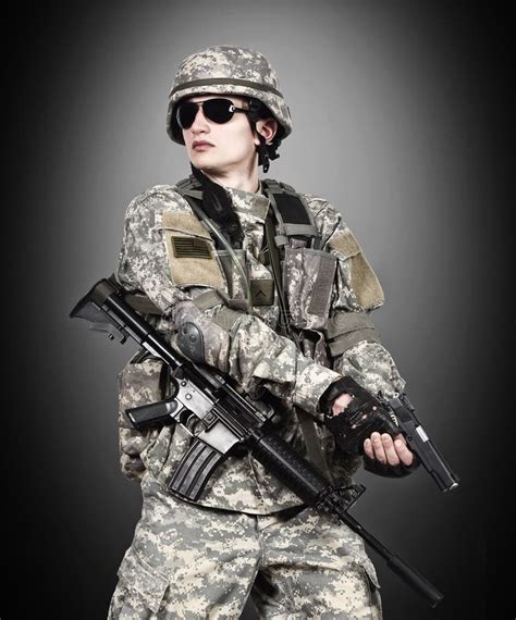 US soldier holding gun stock image. Image of protection - 52376475