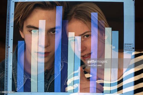 Teenage Girl And Boy Looking At Bar Graph In Computer Screen High-Res Stock Photo - Getty Images