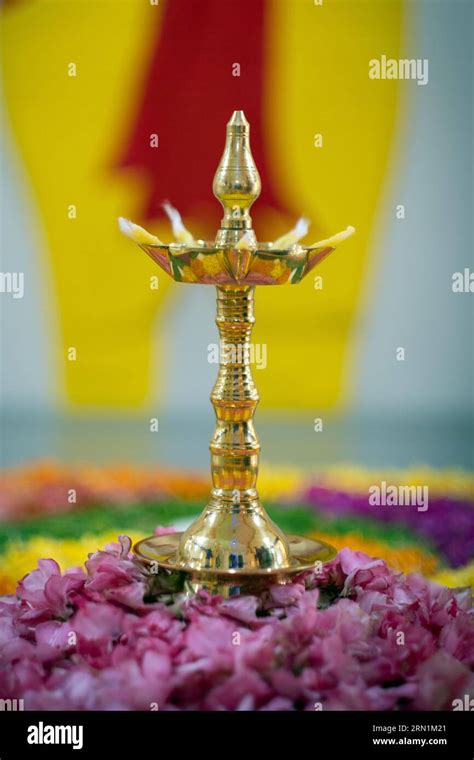 Onam festival, oil lamp, brass lamp, floral rangoli, concept, conceptual, table top, Kerala ...