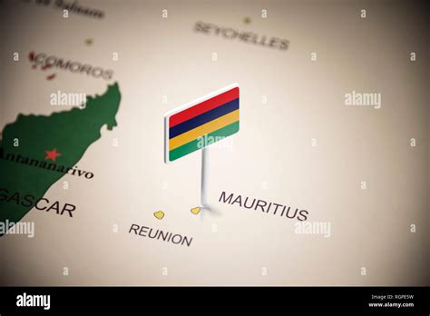 Mauritius marked with a flag on the map Stock Photo - Alamy