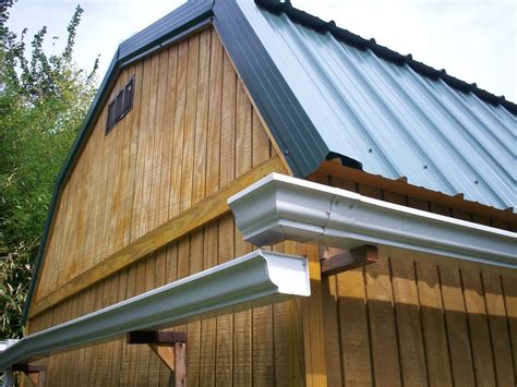 Attaching gutters downspout to a tiny home, Dersen, pre-fab shed building. Thanks to RESILIENCE ...