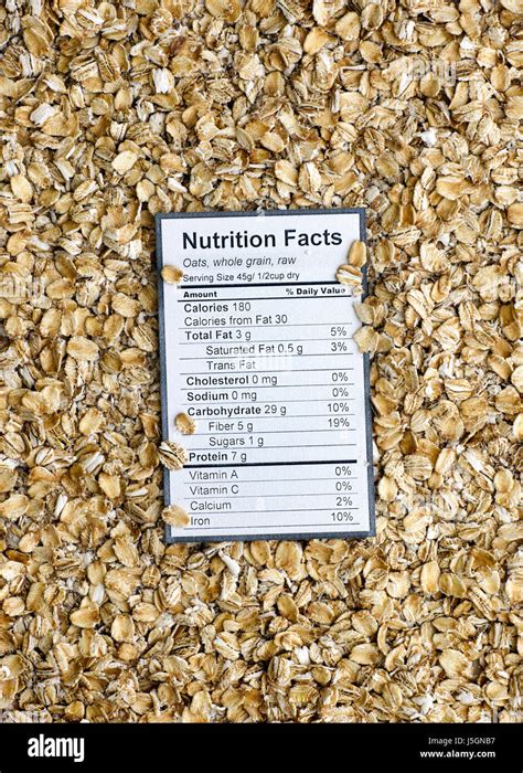 Nutrition facts of whole grain raw oats with oats background Stock ...