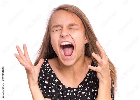 Angry Screaming teen girl, isolated on white background. Human emotions, facial expression ...