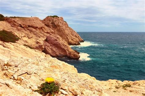 Rock formations by sea against sky | ID: 104983925