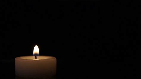 Close up shot of a candle burning in a dark room... Stock Video Footage - Storyblocks