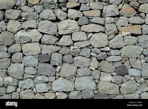 natural stone wall background - rubble wall Stock Photo - Alamy