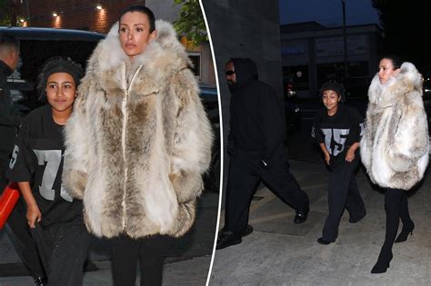 Kanye West’s wife Bianca Censori covers up in fur coat while out with rapper and North West ...