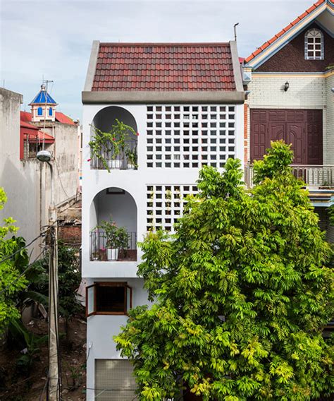 nh village architects adds rainwater collection system in vietnamese house