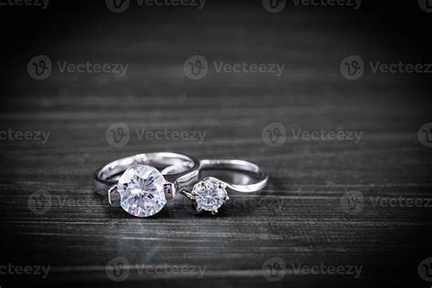 Diamond wedding rings on black background 11388269 Stock Photo at Vecteezy