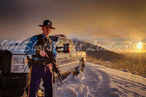 An Alaska State Trooper at sunset on a cold winter day. # ...