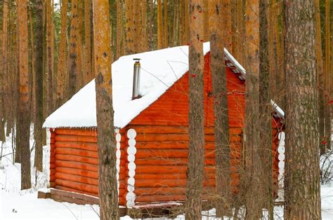 Premium Photo | Log cabin in winter in the forest under the snow.