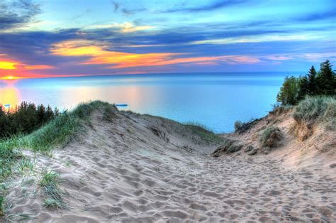 Painterly sunset with skies on the sand dunes at Pictured Rocks ...