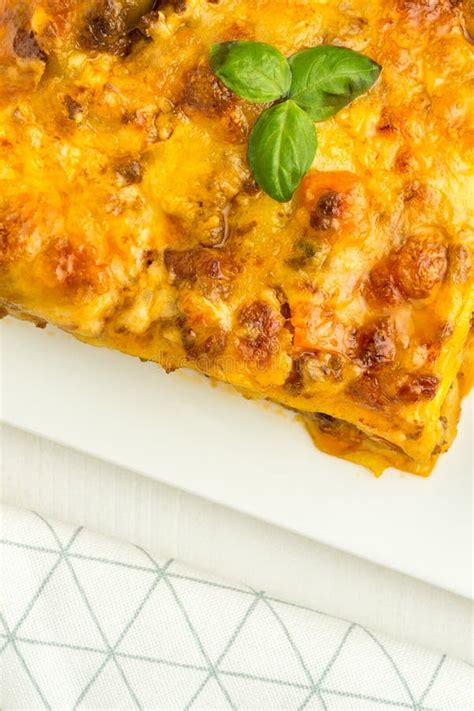 Lasagna with Minced Beef, Bolognese Sauce and Basil on Dark Plate Stock ...