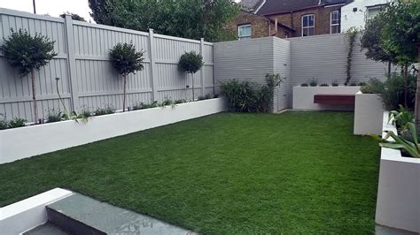 Artificial grass easi grass grey painted fences modern garden design Fulham Chelsea Kensington ...