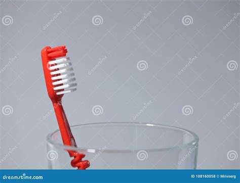 Red Toothbrush in a Glass, Macro Shot Stock Photo - Image of healthy ...