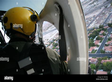 Las Vegas police helicopter flying about suburbs and houses Stock Photo - Alamy