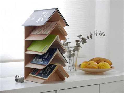 Meet the Wisdom Tree, a bookshelf that looks like a Christmas tree and works like an ambient ...