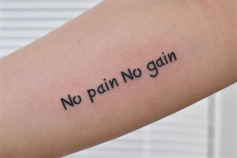 "No pain, no gain" lettering tattoo located on the