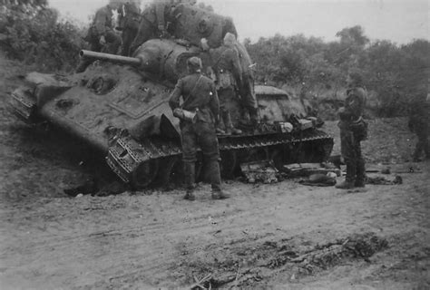 knocked out soviet tank T-34 model 1940 armed with the 76 mm gun L-11 | World War Photos