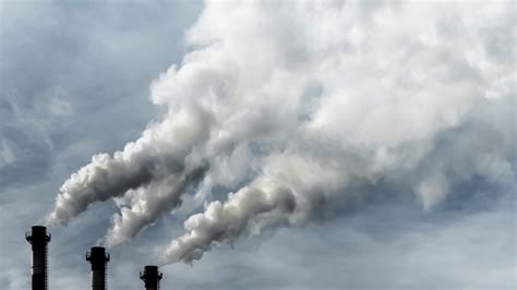 Toxic emissions of toxic gases into the atmosphere, industrial air pollution. Dark chimneys ...