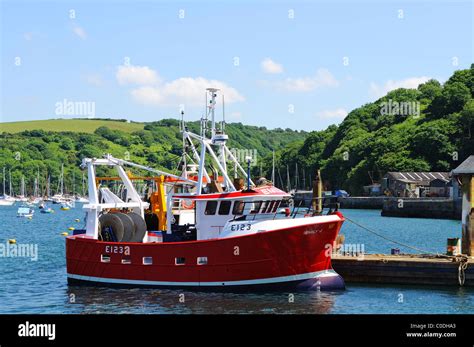 A small fishing trawler moored at Polruan in Cornwall, U.K Stock Photo ...