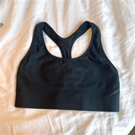 Black Champion sports bra. Size M from Champion. -... - Depop