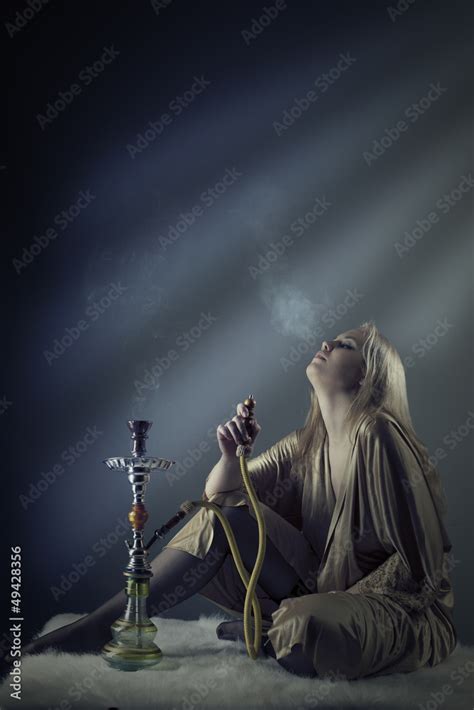 sexy woman smoking the hookah Stock Photo | Adobe Stock