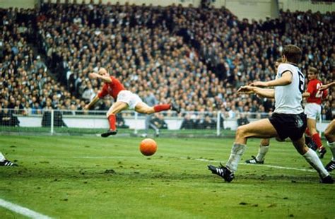 England 4 W Germany 2 in 1966 at Wembley. Bobby Charlton heads the ball back across the German ...