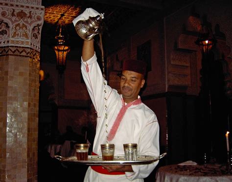 pouring mint tea in a restaurant in the medina of Marrakech, Morocco ...