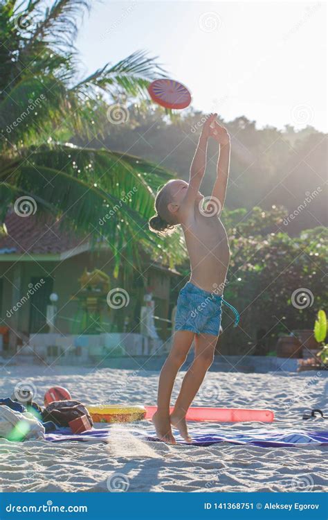 Boy Playing Frisbee on the Beach Stock Image - Image of beach, modern ...