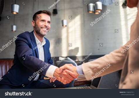 Business People Shaking Hands During Meeting Stock Photo 1558527311 | Shutterstock