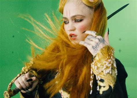 What do Grimes' tattoos mean? | The US Sun