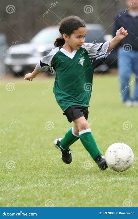 Young Girl Playing Soccer stock image. Image of children - 597809