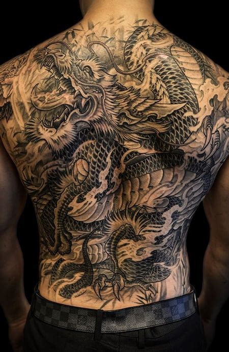 Tribal Dragon Back Tattoos For Men