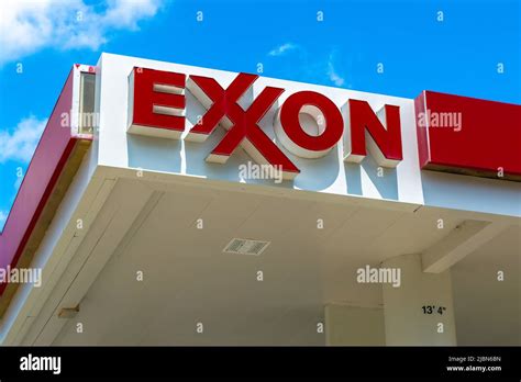 Exxon gas station's outdoor facade brand and logo signage in red ...